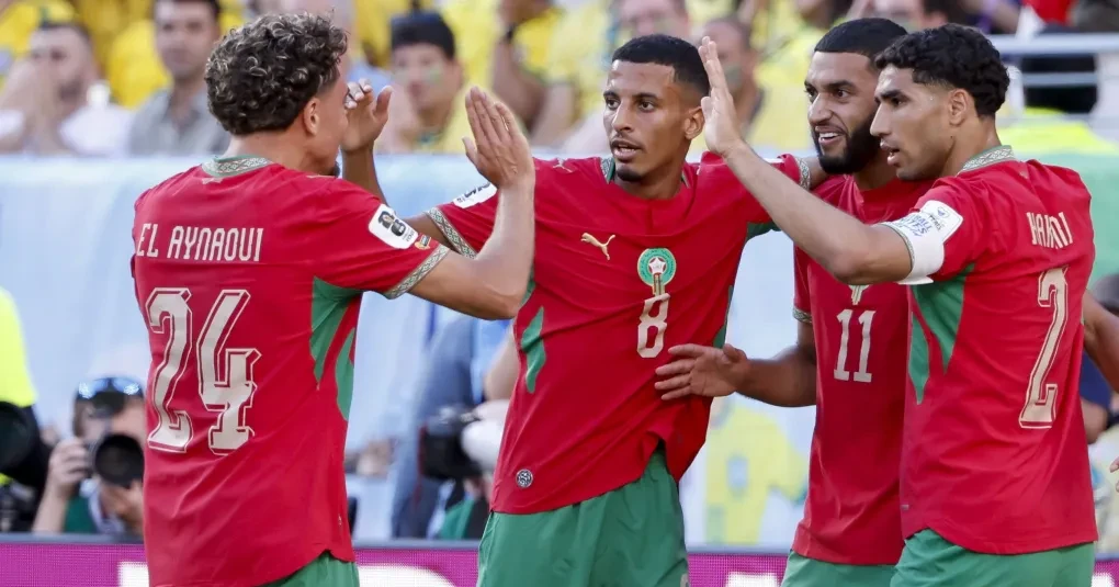 Jogadores de Marrocos e Escócia no aquecimento antes da partida em Boston