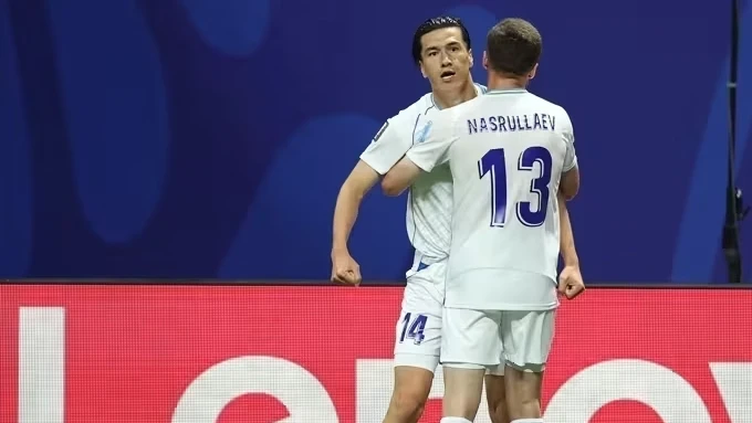 Eldor Shomurodov comemorando gol pela seleção do Uzbequistão contra a República Democrática do Congo