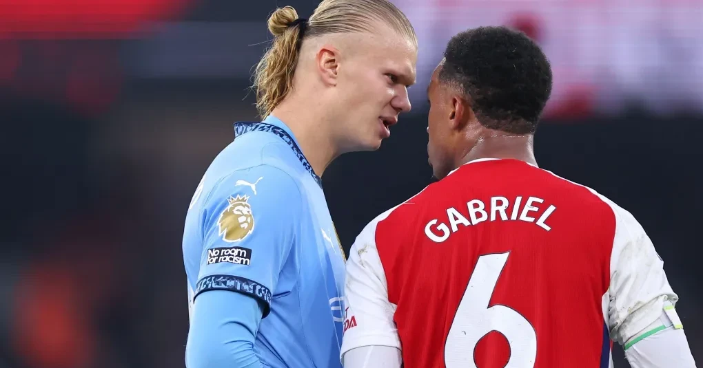 Gabriel Magalhães e Erling Haaland disputando bola em jogo anterior